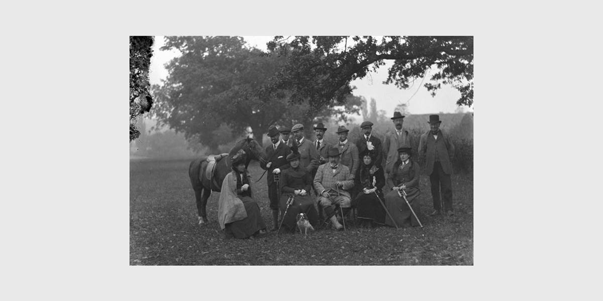 Old black and white photo of people on lawn in Suffolk